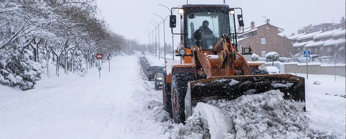 Machine Plowing Snow on Road Machine Plowing Snow on Road