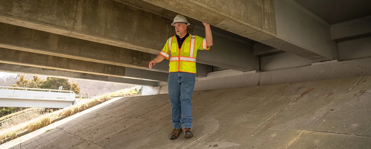 Pillar Worker Underneath Bridge Pillar Worker Underneath Bridge