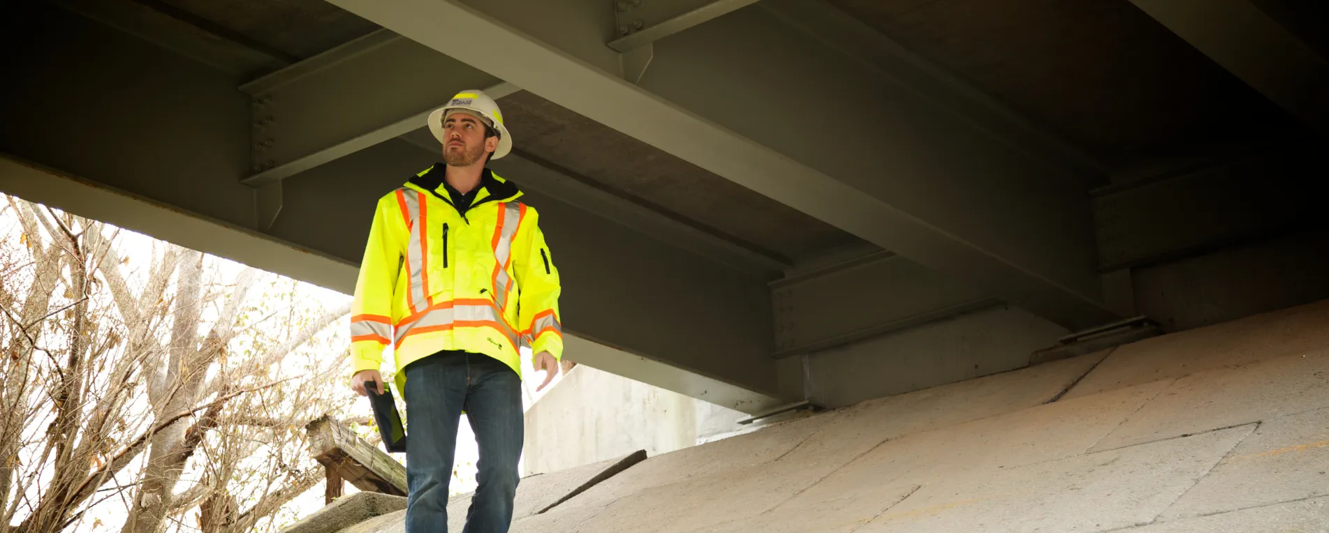 man inspecting bridge man inspecting bridge