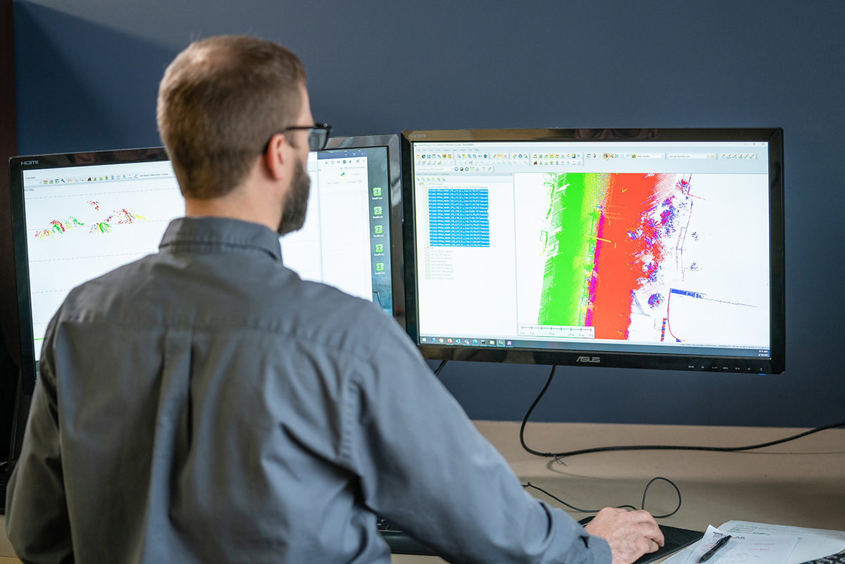 Jacob Behind Computer Looking At mobile LiDAR Scan