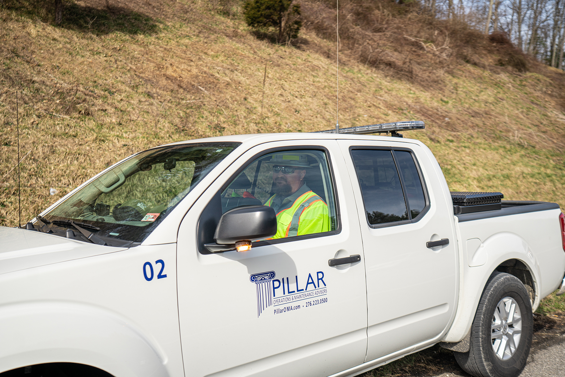 PILLAR Employee Sitting in Truck
